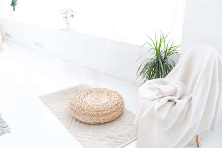 large very bright spacious stylish open plan Bali style apartment with hanging bed and panoramic windows. white floor and walls, simple wooden furniture.の写真素材