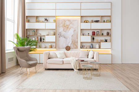 interior design spacious bright studio apartment in Scandinavian style and warm pastel white and...
