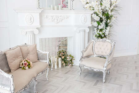 luxurious bright spacious guest room with beautiful chic furniture a huge floor-to-ceiling window in...
