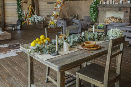 dark cozy interior of big country wooden house, wooden furniture and animal furs. huge panoramic window and very high ceiling.の写真素材