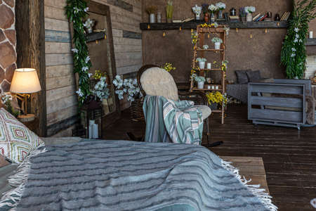 dark cozy interior of big country wooden house, wooden furniture and animal furs. huge panoramic...