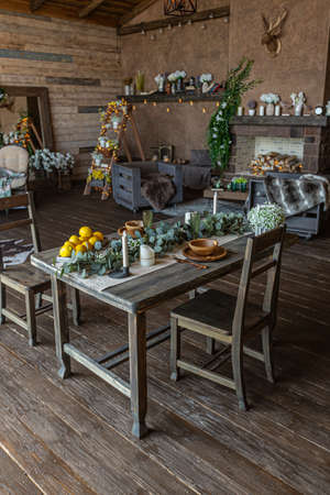 dark cozy interior of big country wooden house, wooden furniture and animal furs. huge panoramic window and very high ceiling.の写真素材