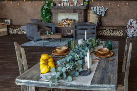 dark cozy interior of big country wooden house, wooden furniture and animal furs. huge panoramic window and very high ceiling.の写真素材