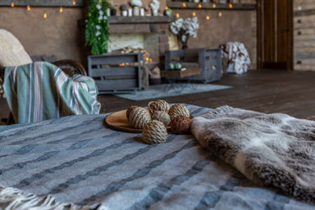 dark cozy interior of big country wooden house, wooden furniture and animal furs. huge panoramic window and very high ceiling.の写真素材