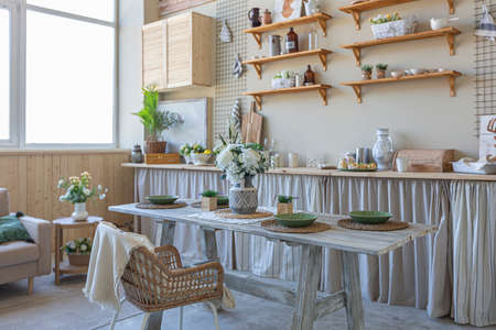 simple cozy home interior of an open plan ordinary room with a kitchen and bedroom area