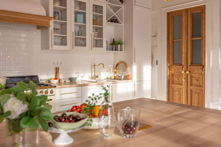 modern expensive luxurious open-plan apartment. Rich Scandinavian-style interior with wooden beams on the ceiling in pastel colorsの写真素材