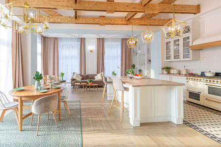modern expensive luxurious open-plan apartment. Rich Scandinavian-style interior with wooden beams on the ceiling in pastel colorsの写真素材