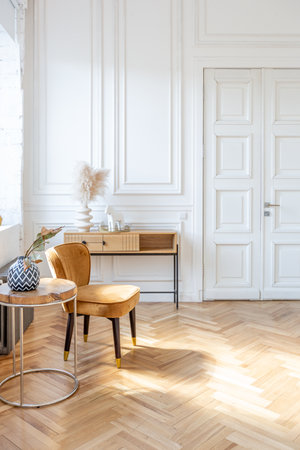 expensive modern light luxury interior design of a spacious living room with wooden elements and white walls. filled with original and unusual decorative thingsの写真素材