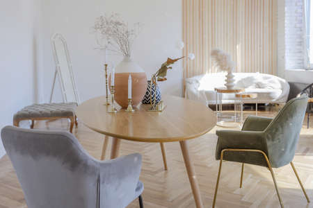 expensive modern light luxury interior design of a spacious living room with wooden elements and...