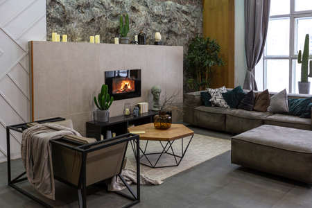 modern studio interior with decorative stone walls in grey. stone wood, tiles and led lighting in...
