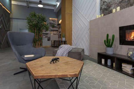modern studio interior with decorative stone walls in grey. stone wood, tiles and led lighting in...