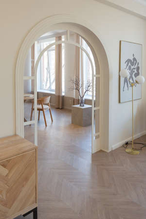 fashionable modern design luxury apartment in light colors. bright day behind huge windows. stylish...