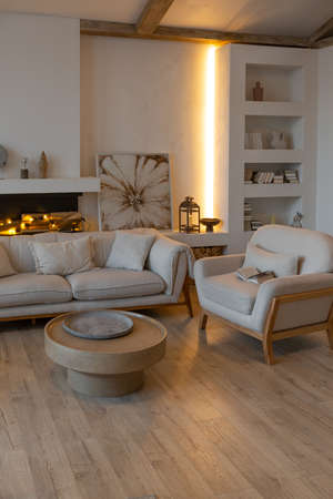 cozy warm home interior of a chic country house with an open plan, wood finishes, warm colors and a...