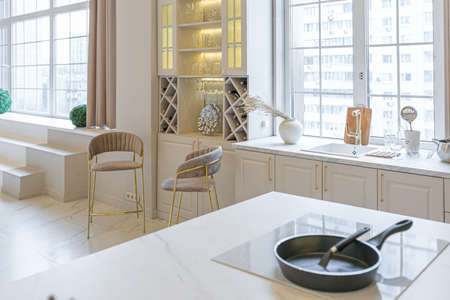 the latest fashion home trends in an ultra modern elegant interior of a cozy studio in soft pastel...