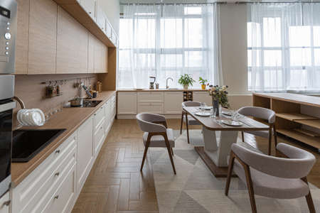 minimalist modern interior design huge bright apartment with an open plan in Scandinavian style in white, blue and dark blue colors with columns in the center. includes kitchen area, office and loungeの写真素材