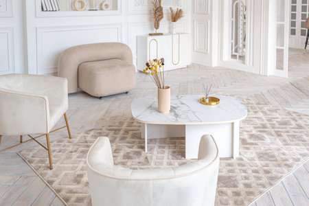 snow-white luxury apartment interior with Egyptian-style decor with light stylish furniture. huge...