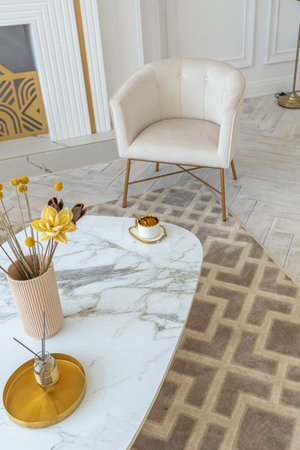 snow-white luxury apartment interior with Egyptian-style decor with light stylish furniture. huge...