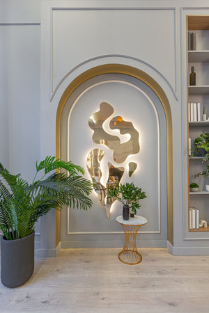 stylish luxury interior of modern studio apartment in green pastel colors with wooden elements. expensive furniture and decorationsの写真素材