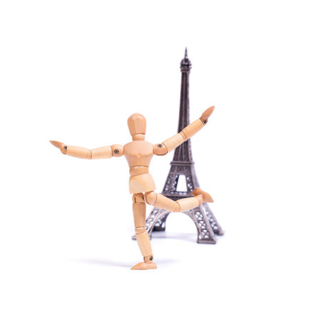 Wooden mannequin with Eiffel tower on white backgroundの写真素材