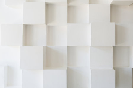 Abstract geometric pattern of white cubes on a white wall. Abstract backgroundの写真素材