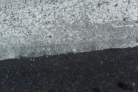 Asphalt texture with some fine grain in it. Great background or texture.の写真素材