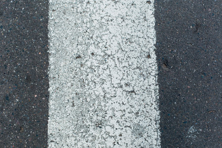 White line on the asphalt road. Abstract background and texture for design.の写真素材
