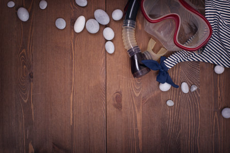Snorkeling equipment on wooden background. Top view with copy spaceの写真素材