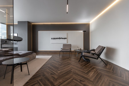 cool expensive interior design of room in prestigious luxury hotel with dark tones with modern LED lighting and stylish furniture. the area with a sink is separated by dark glass from the bedroomの写真素材