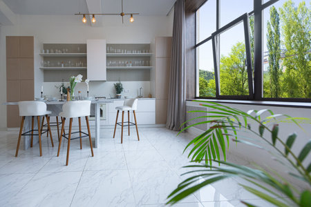 close view kitchen with dinning marble table and hight bar stools in minimalistic light elegant...