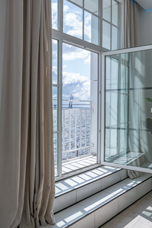 minimalistic modern luxury design of an expensive house with marble trim on a sunny day. white walls...