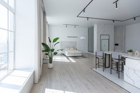 minimalistic modern luxury design of an expensive house with marble trim on a sunny day. white walls with plaster, parquet, decorative lighting and no one insideの写真素材
