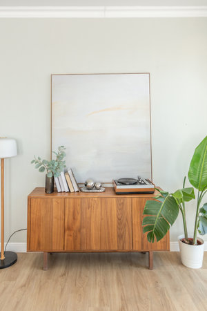 cozy bright apartment with huge panoramic windows with sunlight. bedroom in white and beige tones...