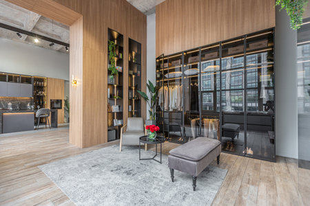 huge modern spacious apartment with high ceilings, panoramic windows with fantastic view, wooden decor, kitchen area, separate shower in greenery and dressing roomの写真素材