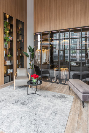 stylish dressing room with led lights in huge modern spacious apartment with high loft style...