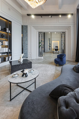 stylish cozy light bright luxurious spacious interior of a country house white walls with ornaments,...