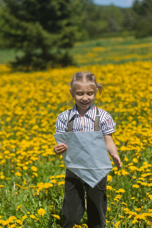 Happy Young  Woman Writing i and Smiling in summer Garden.の写真素材