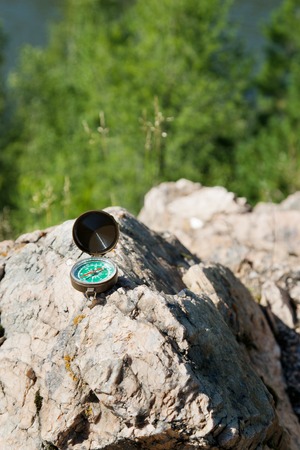 Analogic Compass Abandoned on the Rocks in the summer