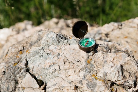 Analogic Compass Abandoned on the Rocks in the summerの写真素材