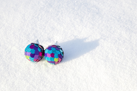 Two decorative spheres on a white snow. For Christmas, New year holidaysの写真素材