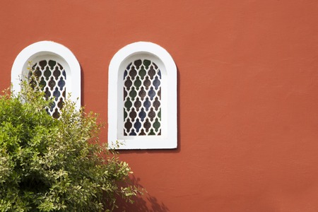 Ancient  window with decorative grid in a old Arab buildingの写真素材