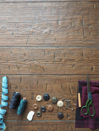 Sewing accessories  in a wood background.の写真素材