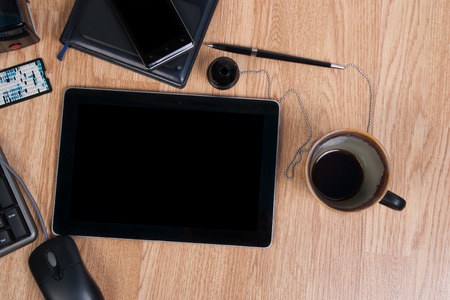 Office work desk with a cup of coffee. Inserting text.の写真素材