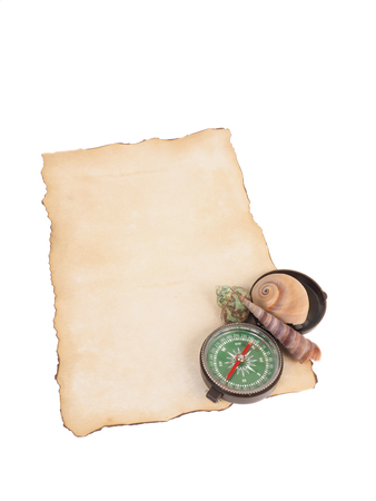 Old paper, compass and shells isolated on white background.の写真素材