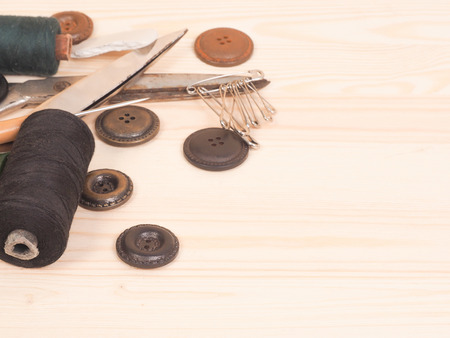 Sewing accessories in a wood background. sewing concept.の写真素材