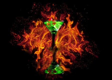 Red dice in a cocktail glass on Fire background. casino series.の写真素材