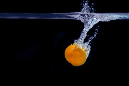 splash of tangerine in water. freshness concept.の写真素材