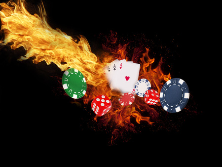 Playing cards and chips on fire. casino concept.の写真素材