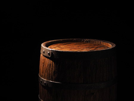 Old barrel with cognac on wooden backgroun.の写真素材
