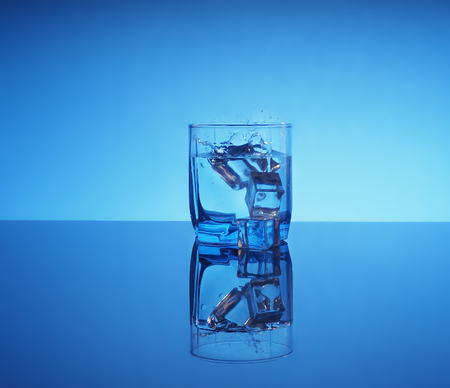 Glass of mineral clear water with ice.の写真素材
