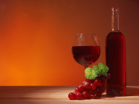 Glass of Red Wine on wooden backgraundの写真素材